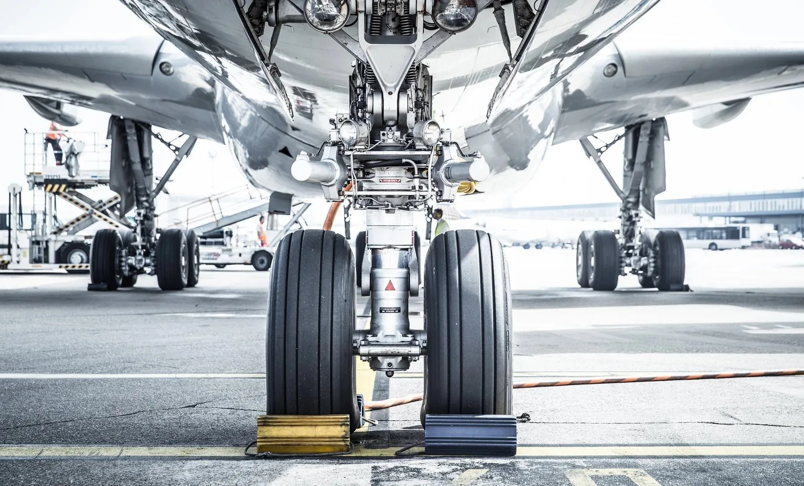 Business jet landing gear chocked on the ramp before departure