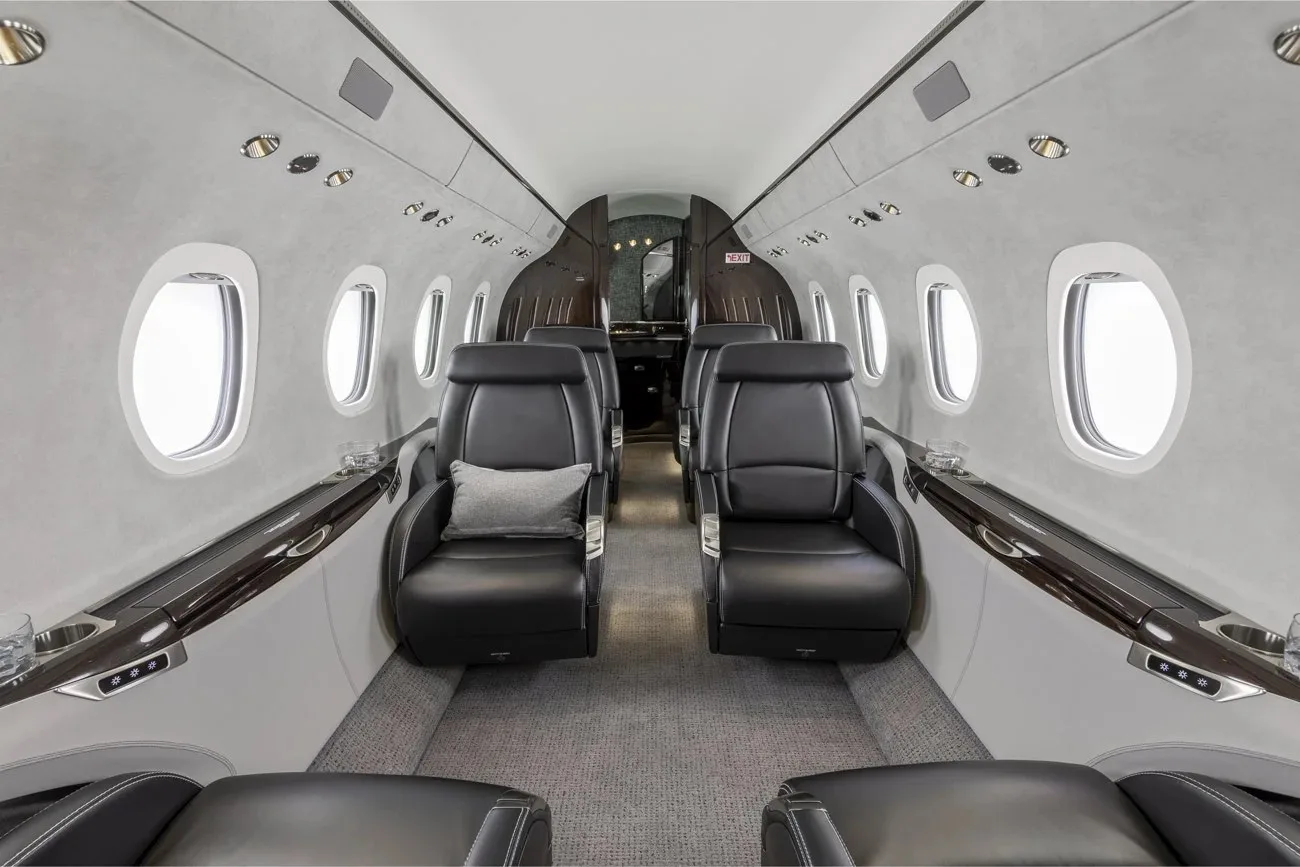 Empty leather seats in a private jet cabin