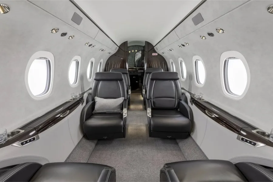 Empty leather seats in a private jet cabin
