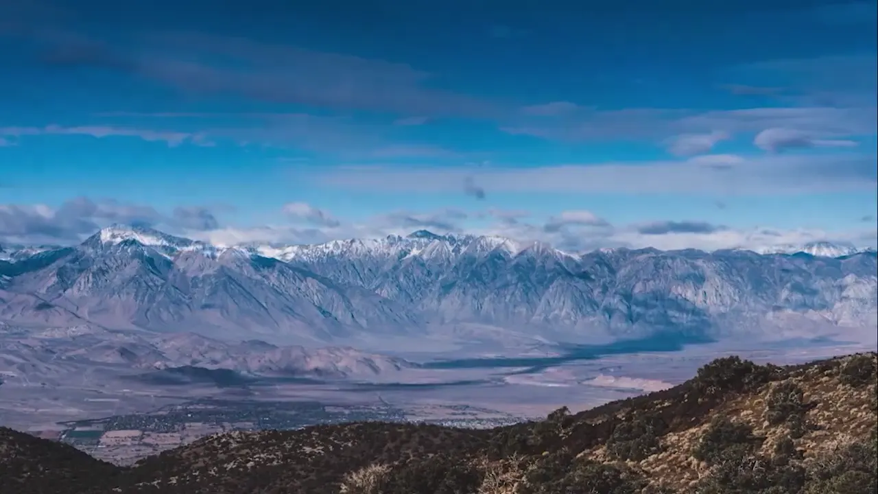 Mountain range under a blue sky