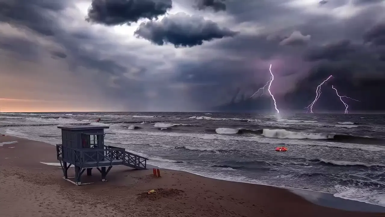 Lightning over a beach and lifeguard tower